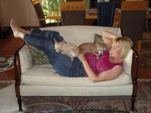 Nadine on the sofa with her tranquilizer dogs